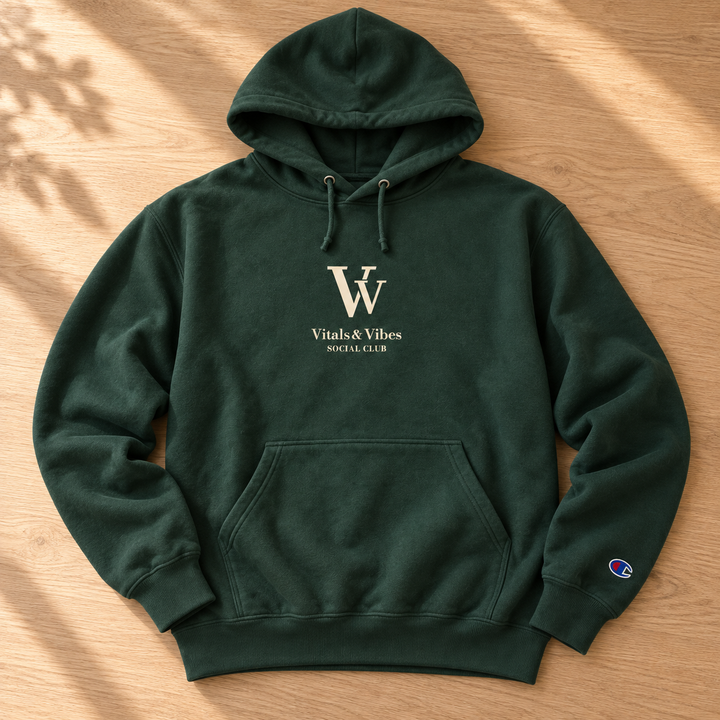 Social Club hoodie in Dark Green, laid out on a table, showing the VV, Vitals & Vibes and Social Club chest print.