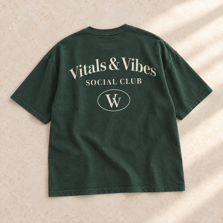 Oversized Social Club tee in Forest, laid out on a table, showing the back design.