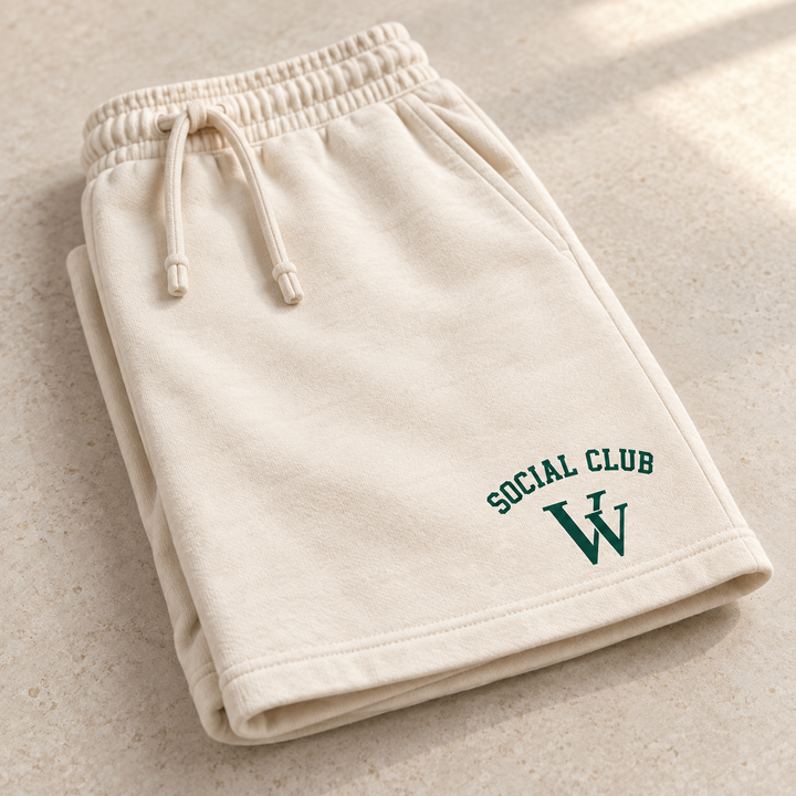 Garment-dyed sweatshorts in Ivory, folded for a close detail view, showing the design and garment details.