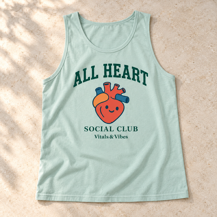 Relaxed unisex tank in Chalky Mint, laid out on a table, showing the design and garment details.