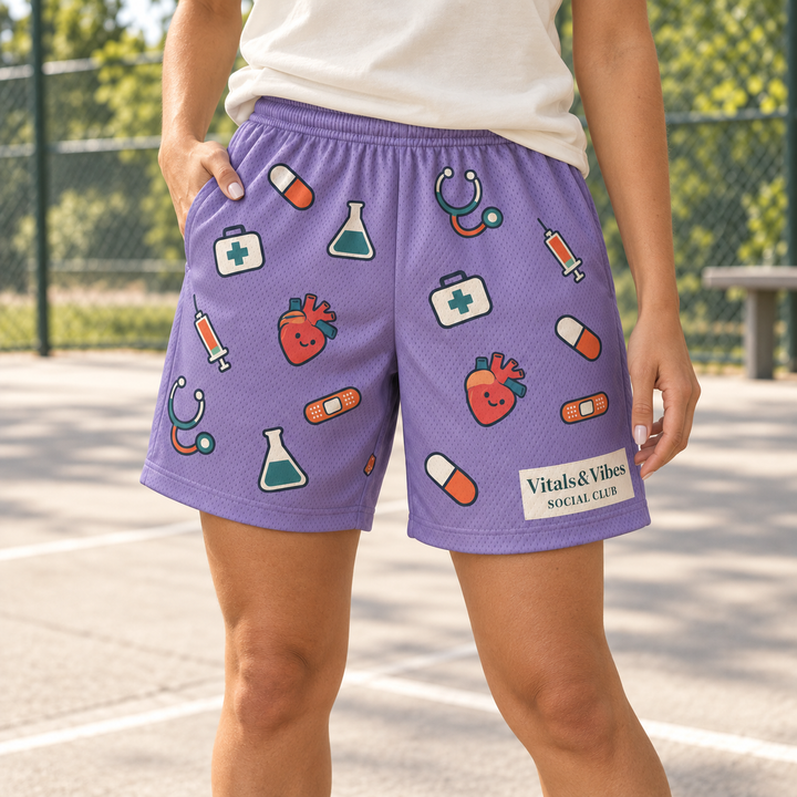 Woman beside an outdoor court wearing lavender mesh shorts covered in colorful medical drawings with a cream Social Club panel.