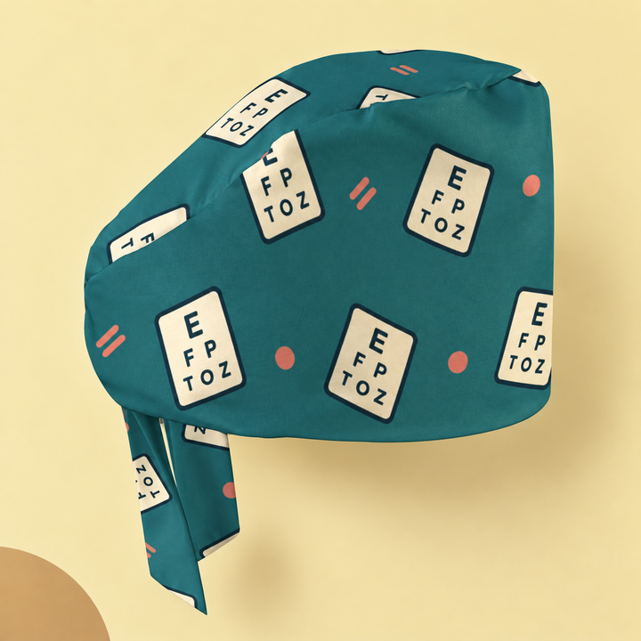 Eye Chart Regular Scrub Cap — Studio view of the printed regular scrub cap on a coordinated background.