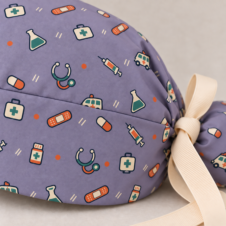 All Medicine ponytail scrub cap — close-up mockup showing the printed fabric and stitched seam.