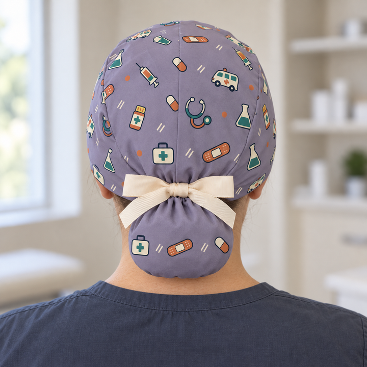 All Medicine Ponytail Scrub Cap — Rear worn view showing the printed ponytail pouch and cream ribbon bow.