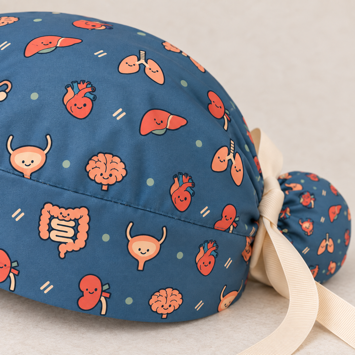 All Organs ponytail scrub cap — close-up mockup showing the printed fabric and stitched seam.