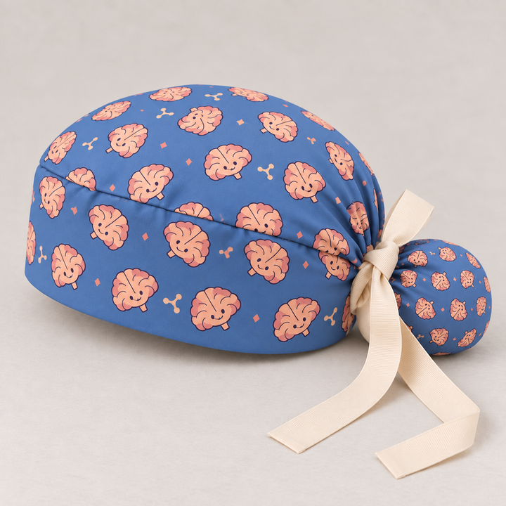 Brain ponytail scrub cap — studio mockup showing the printed cap and cream ties.