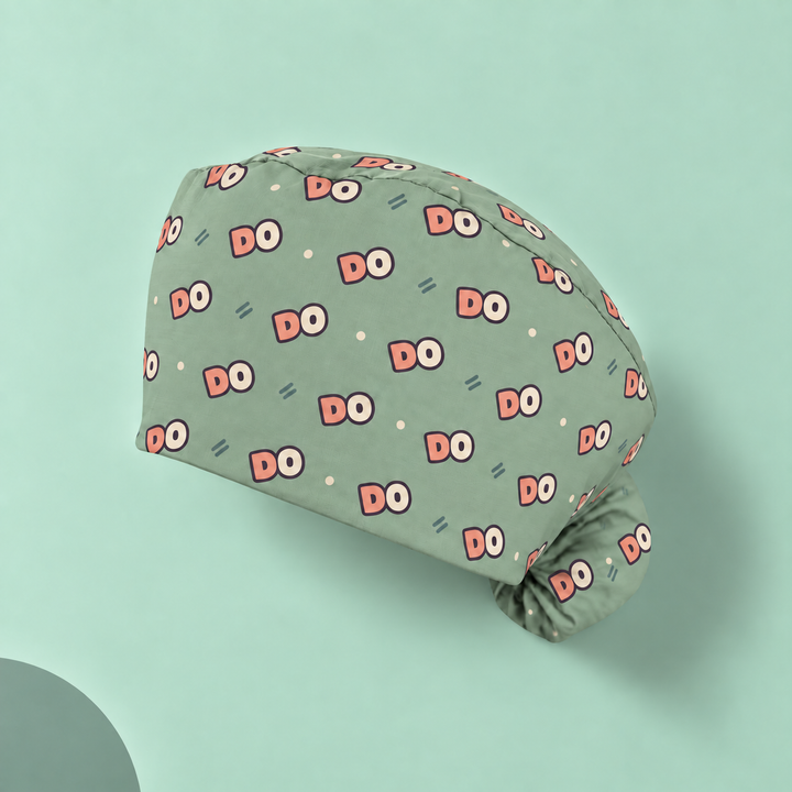 DO Ponytail Scrub Cap — Studio view of the printed cap on a coordinated background.
