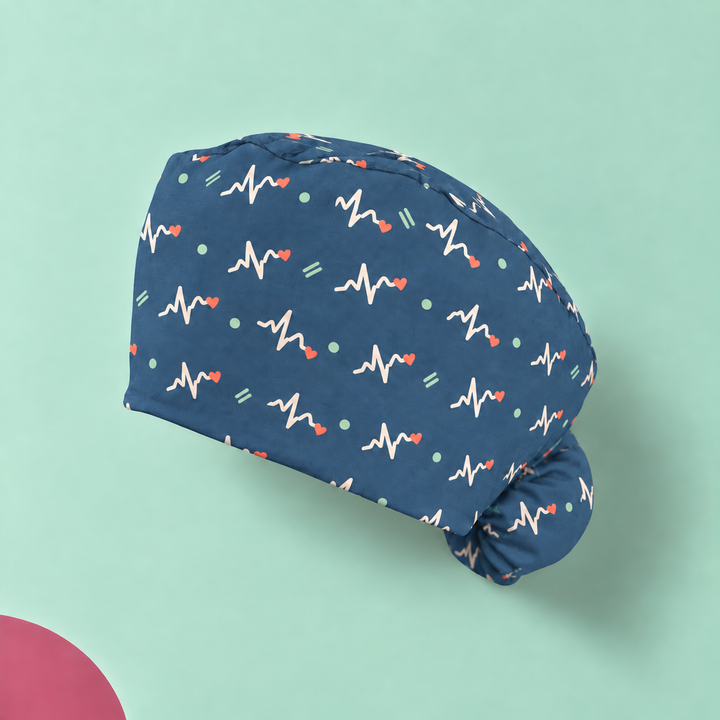 ECG Ponytail Scrub Cap — Studio view of the printed cap on a coordinated background.