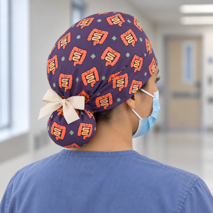 Intestine Ponytail Scrub Cap — Rear worn view showing the printed ponytail pouch and cream ribbon bow.