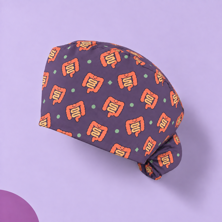 Intestine Ponytail Scrub Cap — Studio view of the printed cap on a coordinated background.