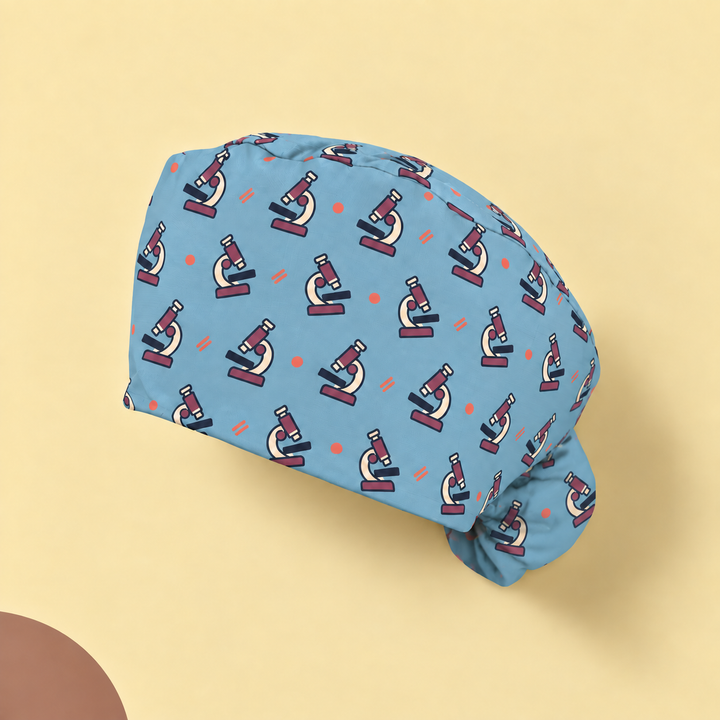 Microscope Ponytail Scrub Cap — Studio view of the printed cap on a coordinated background.
