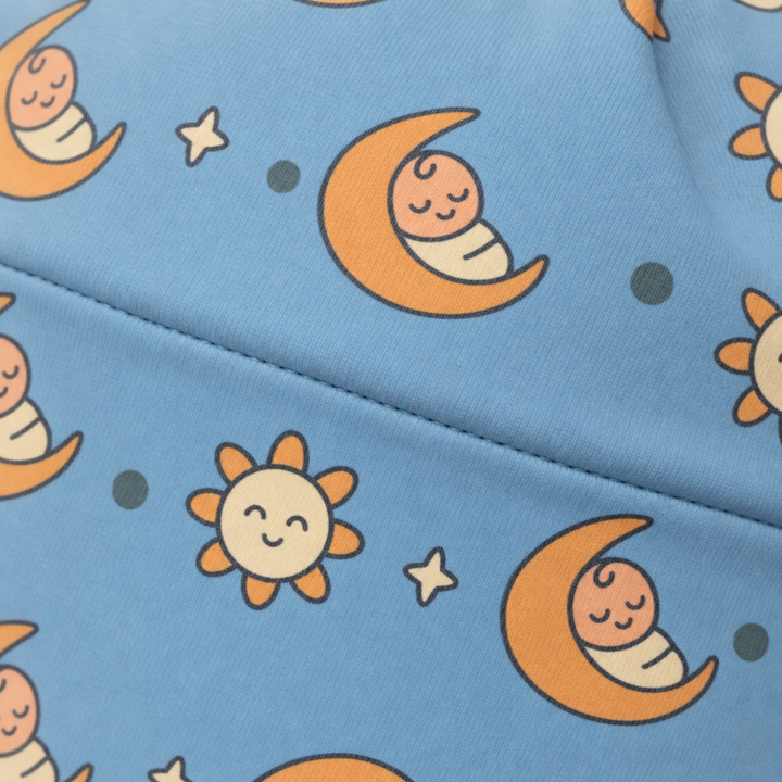 Pediatric ponytail scrub cap — close-up mockup showing the printed fabric and stitched seam.