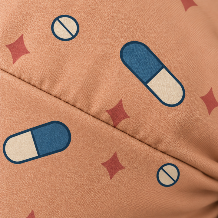 Pill ponytail scrub cap — close-up mockup showing the printed fabric and stitched seam.