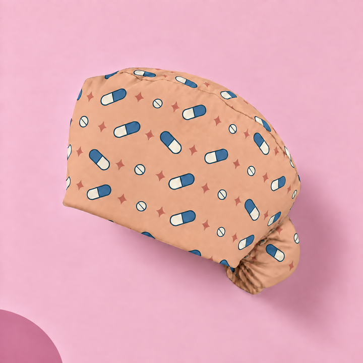 Pill Ponytail Scrub Cap — Studio view of the printed cap on a coordinated background.