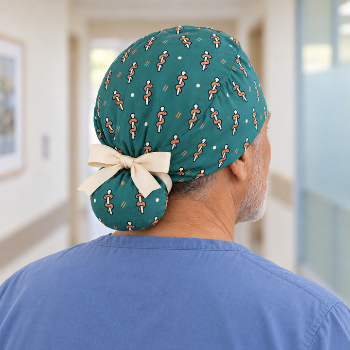 Rod of Asclepius Ponytail Scrub Cap — Rear worn view showing the printed ponytail pouch and cream ribbon bow.