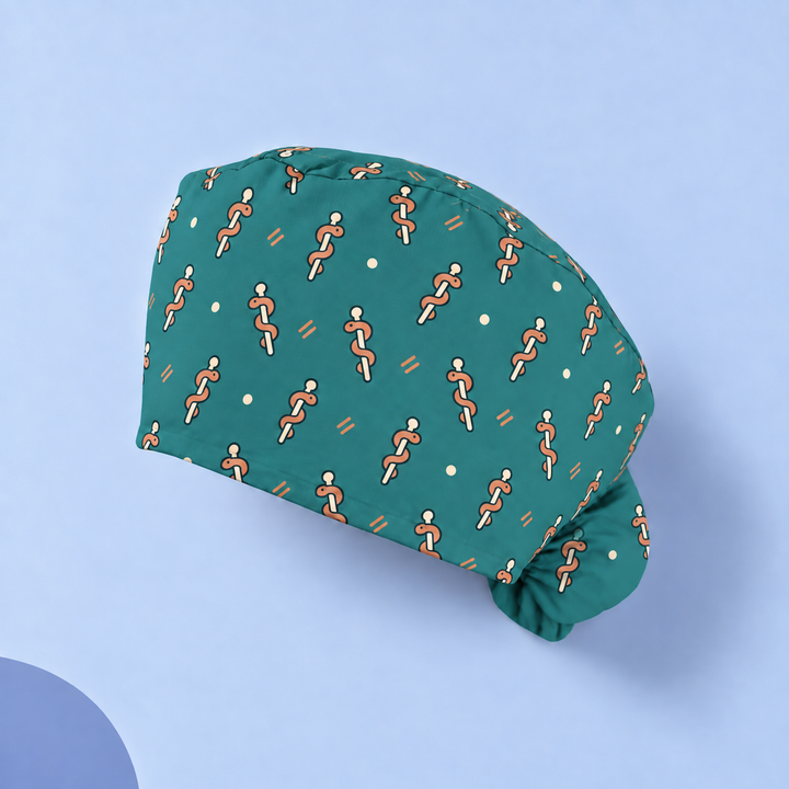 Rod of Asclepius Ponytail Scrub Cap — Studio view of the printed cap on a coordinated background.