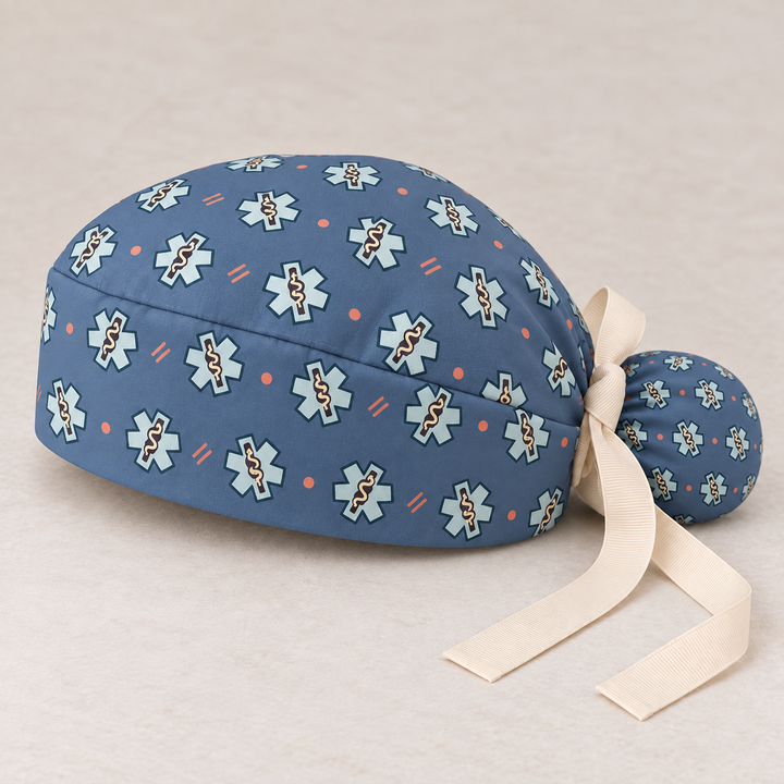 Star of Life ponytail scrub cap — studio mockup showing the printed cap and cream ties.