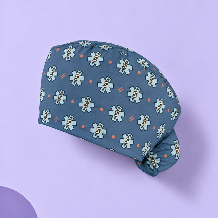 Star of Life Ponytail Scrub Cap — Studio view of the printed cap on a coordinated background.