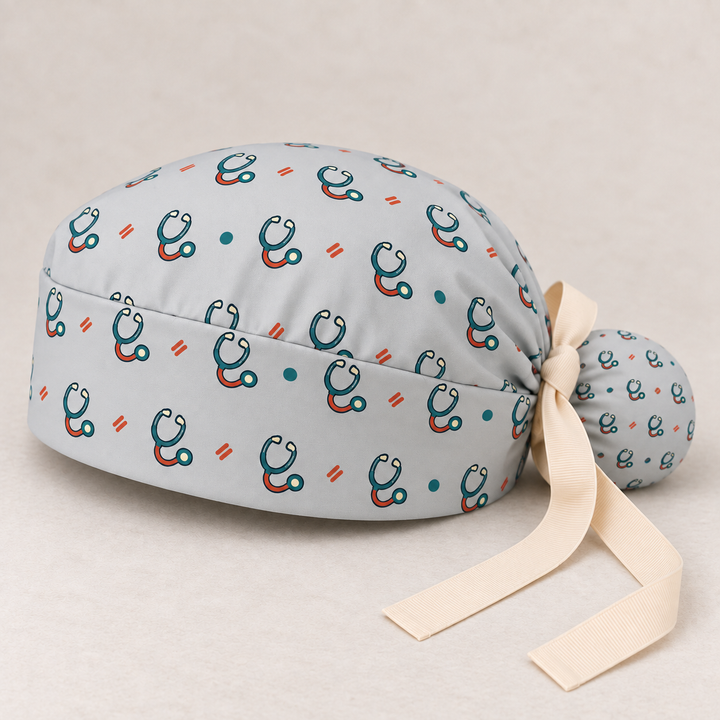 Stethoscope ponytail scrub cap — studio mockup showing the printed cap and cream ties.