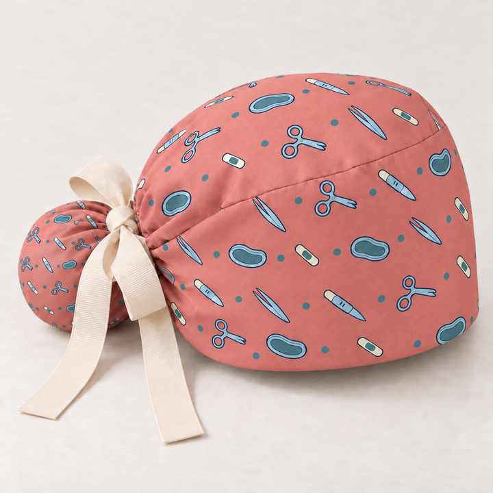 Surgery ponytail scrub cap — studio mockup showing the printed cap and cream ties.
