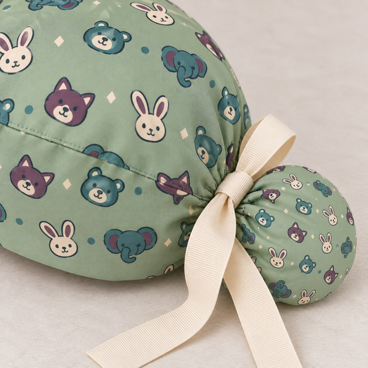 Veterinary ponytail scrub cap — close-up mockup showing the printed fabric and stitched seam.